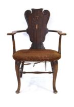 A Scottish mahogany elbow chair with tulip decorated splat over an upholstered seat and cabriole