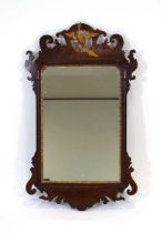 A 19th century walnut and gilded wall mirror surmounted by a bird within a fretwork frame, 74 x 45