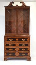 An early 19th century kingwood, satinwood, feather crossbanded and strung bookcase-cabinet, the pair