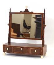 An early 19th century mahogany and satinwood strung dressing table mirror, the rectangular plate
