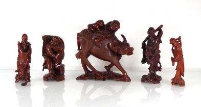 A Chinese Export carved figural group modelled as a water buffalo and riders together with four