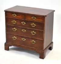 A George II/III mahogany and crossbanded chest of small proportions, the two short drawers over