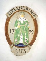 A Greene King 'Ales' ceramic wall plaque, 60 x 38 cm *Originally designed in 1933 by George Kruger