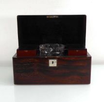 A 19th century rosewood tea caddy of plain form with mother-of-pearl plaques, the interior with