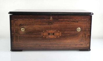 A 19th century cylinder music box with six graduated bells and bee strikers, within a rosewood,