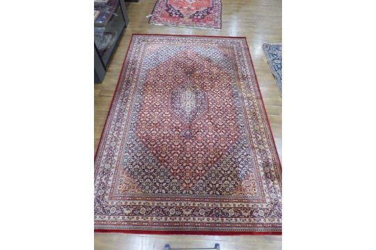 A Belgian Ambassador wool carpet with repeating scroll motifs within a burgundy ground, 300 x 200 cm - Image 2 of 11