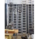 Double sectioned ladder with roof ladder bar