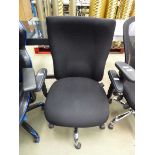 Black cloth swivel armchair