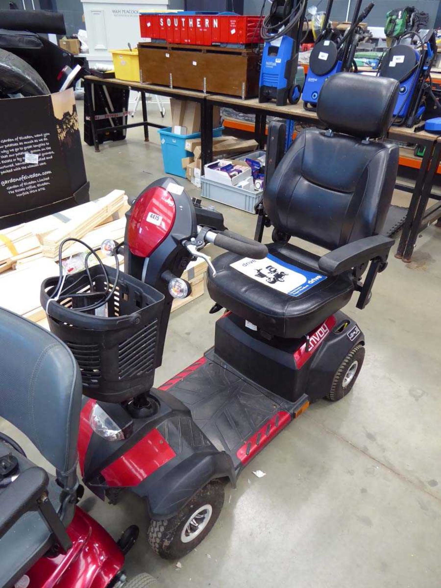 Red 4 wheel drive mobility scooter with key and charger