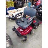 Red disability wheelchair with charger