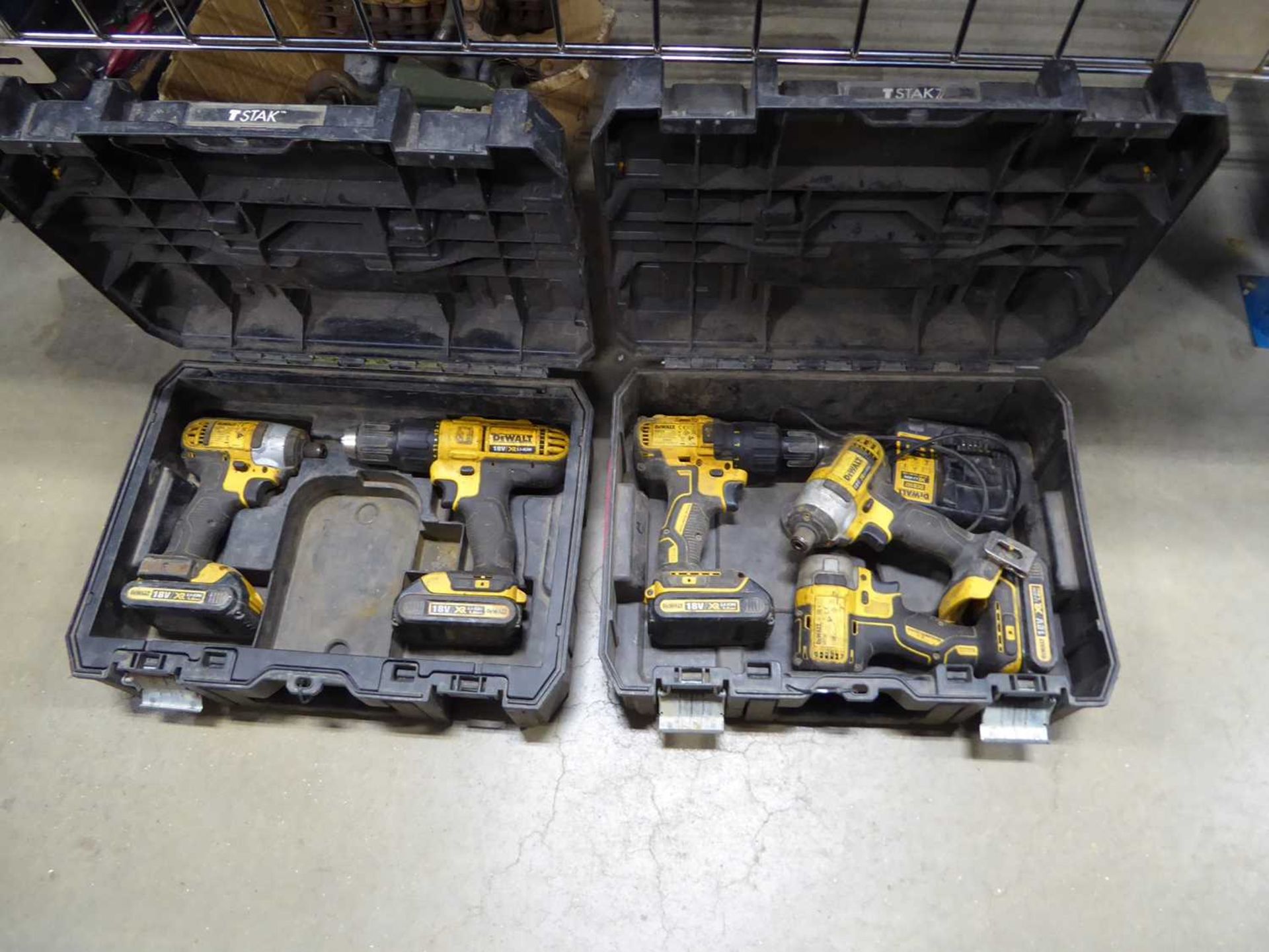 +VAT DeWalt tool kit consisting of three impact drives, two drills, four batteries and a charger