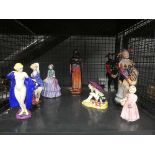Cage containing collection of Royal Doulton figures incl. The Jesters, a Moor, and ladies Rita