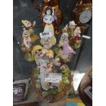 Nine Doulton Snow White and Dwarf figures