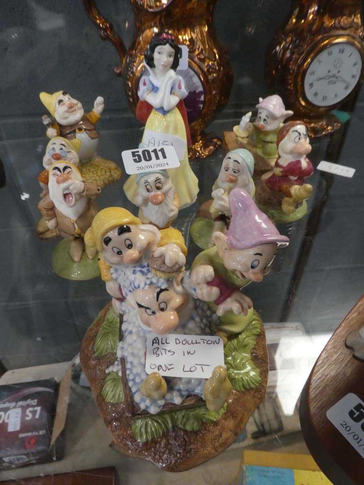 Nine Doulton Snow White and Dwarf figures