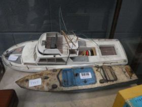 Two plastic and tin plate toy boats