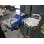 Two tin plate police cars