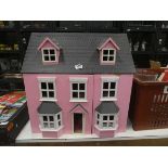 Pink painted dollshouse