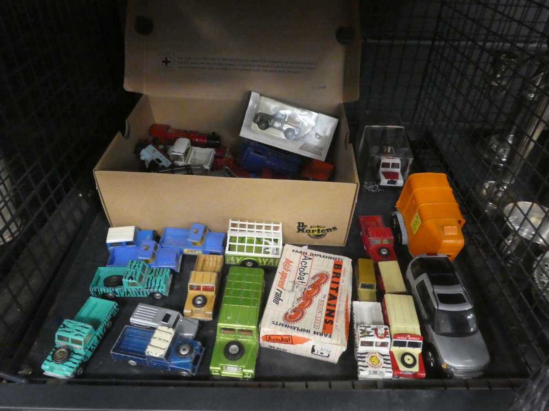 Cage containing loose and boxed die cast vehicles