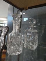 Three cut glass decanters