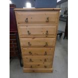 Narrow pine chest of six drawers