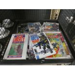 Cage containing Martha Washington and other comics