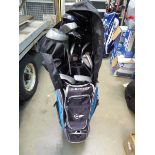 Blue and black Dunlop golf bag with assortment of clubs