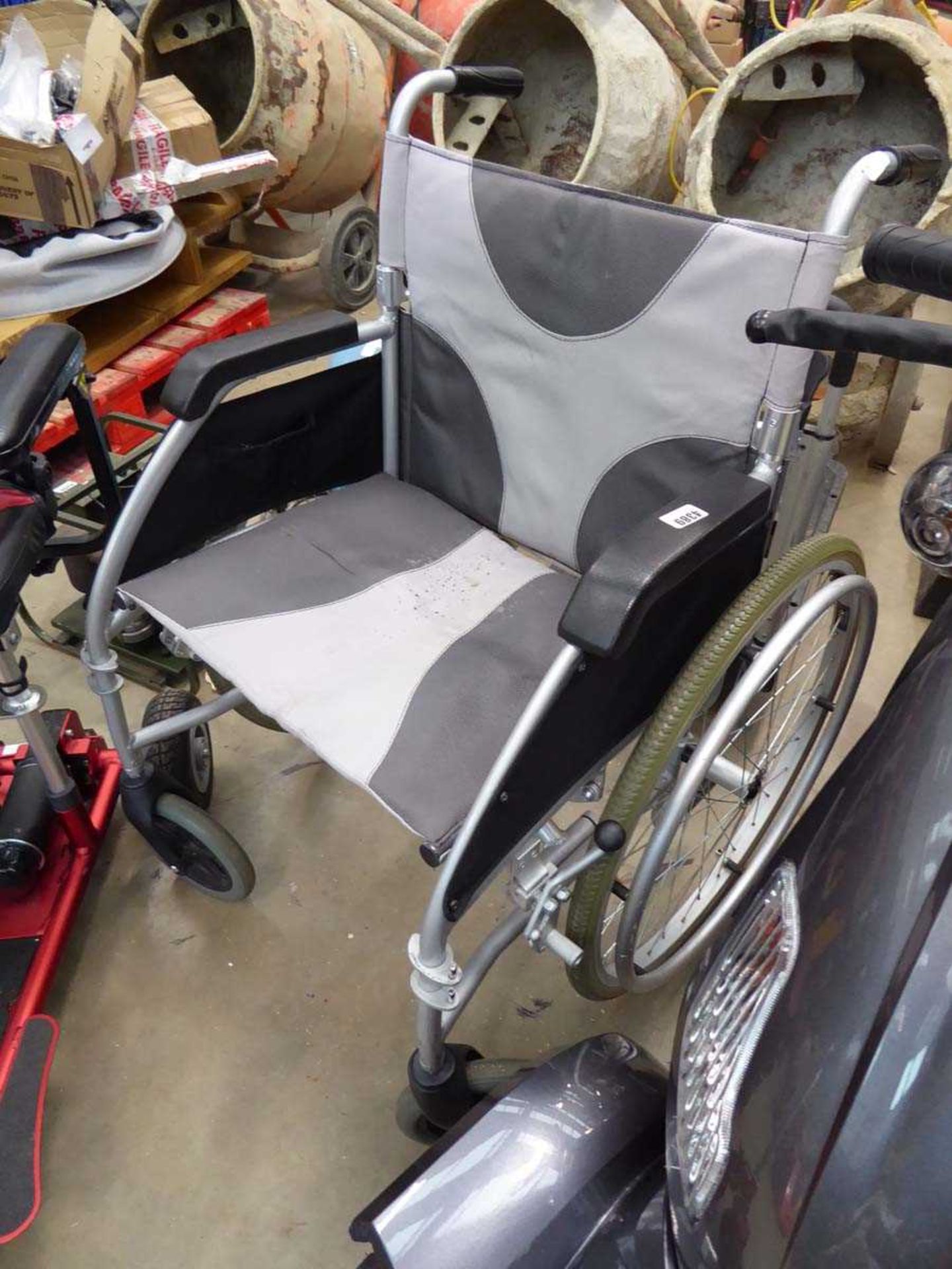 Grey fold up wheelchair