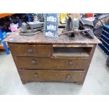 Wooden chest of drawers with various assorted tools