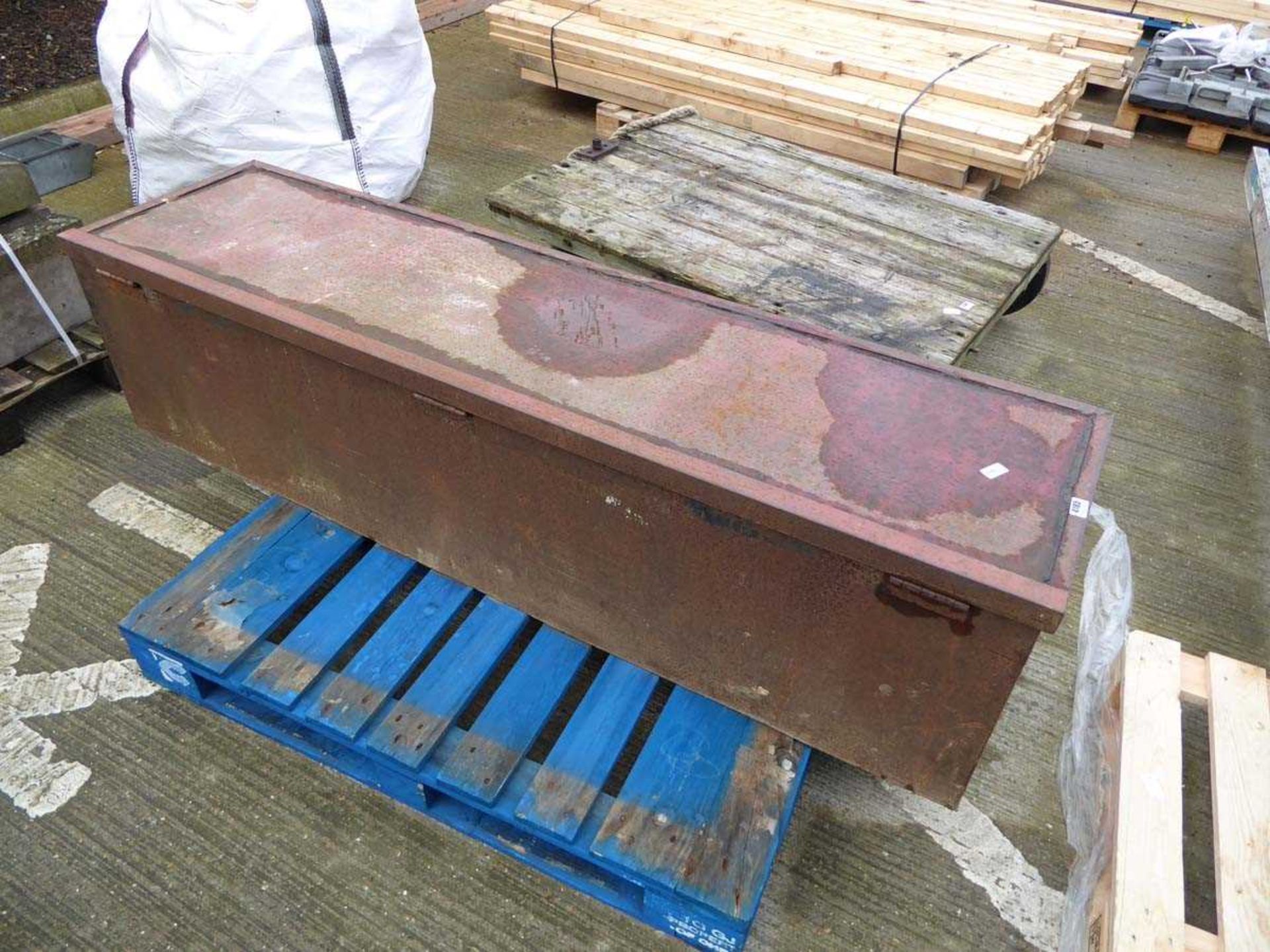 Large metal storage box with hole in the bottom