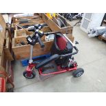 Red 3 wheel fold up mobility scooter