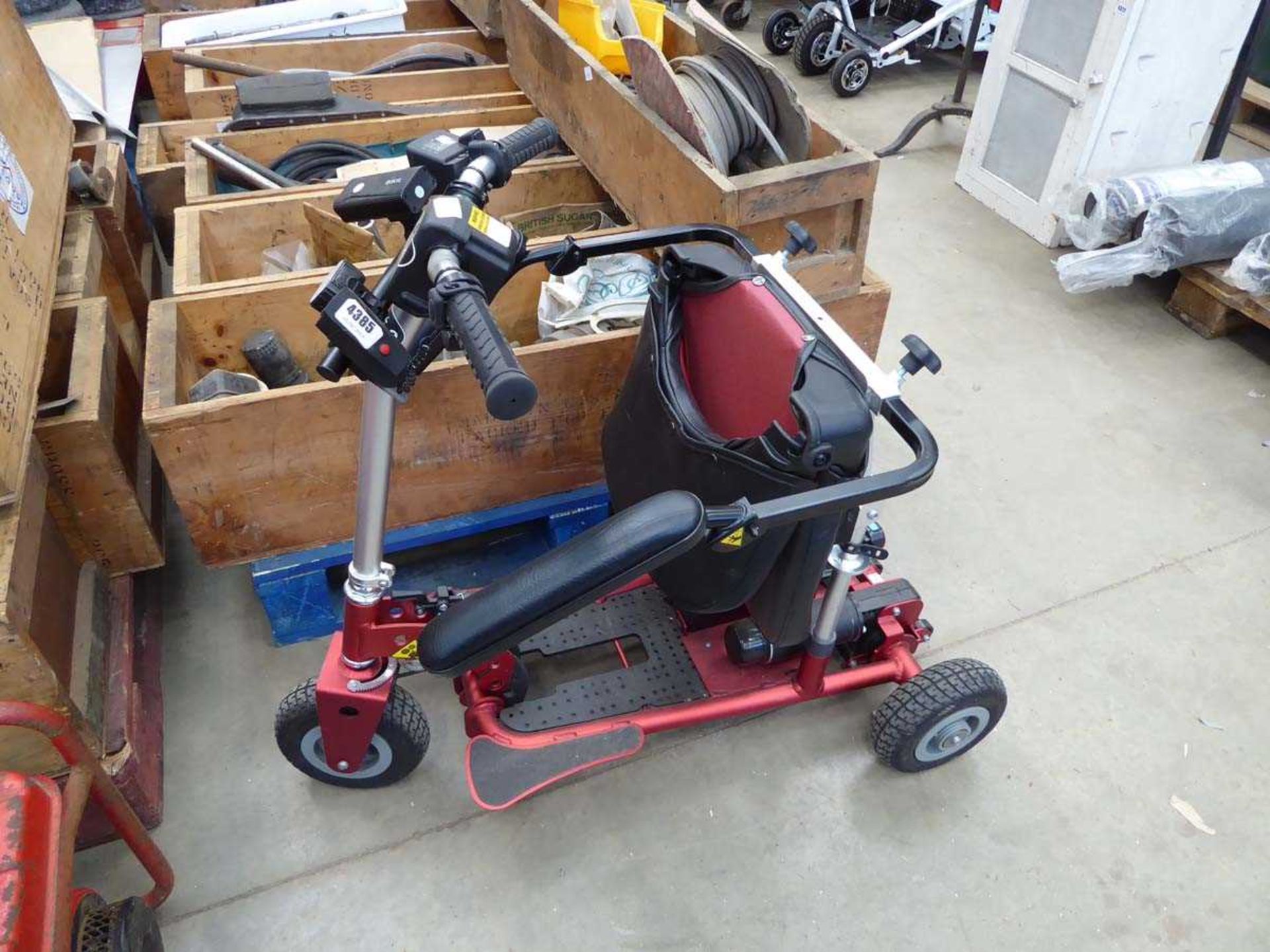 Red 3 wheel fold up mobility scooter