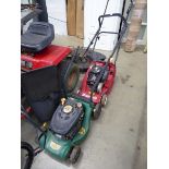 Green petrol powered rotary mower with grass box