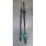 Two long reach battery hedge cutters