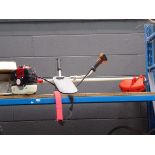 Shopping.co.uk petrol powered red strimmer with accessories
