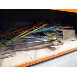 Underbay of assorted tools including forks, shears, edgers, spades etc