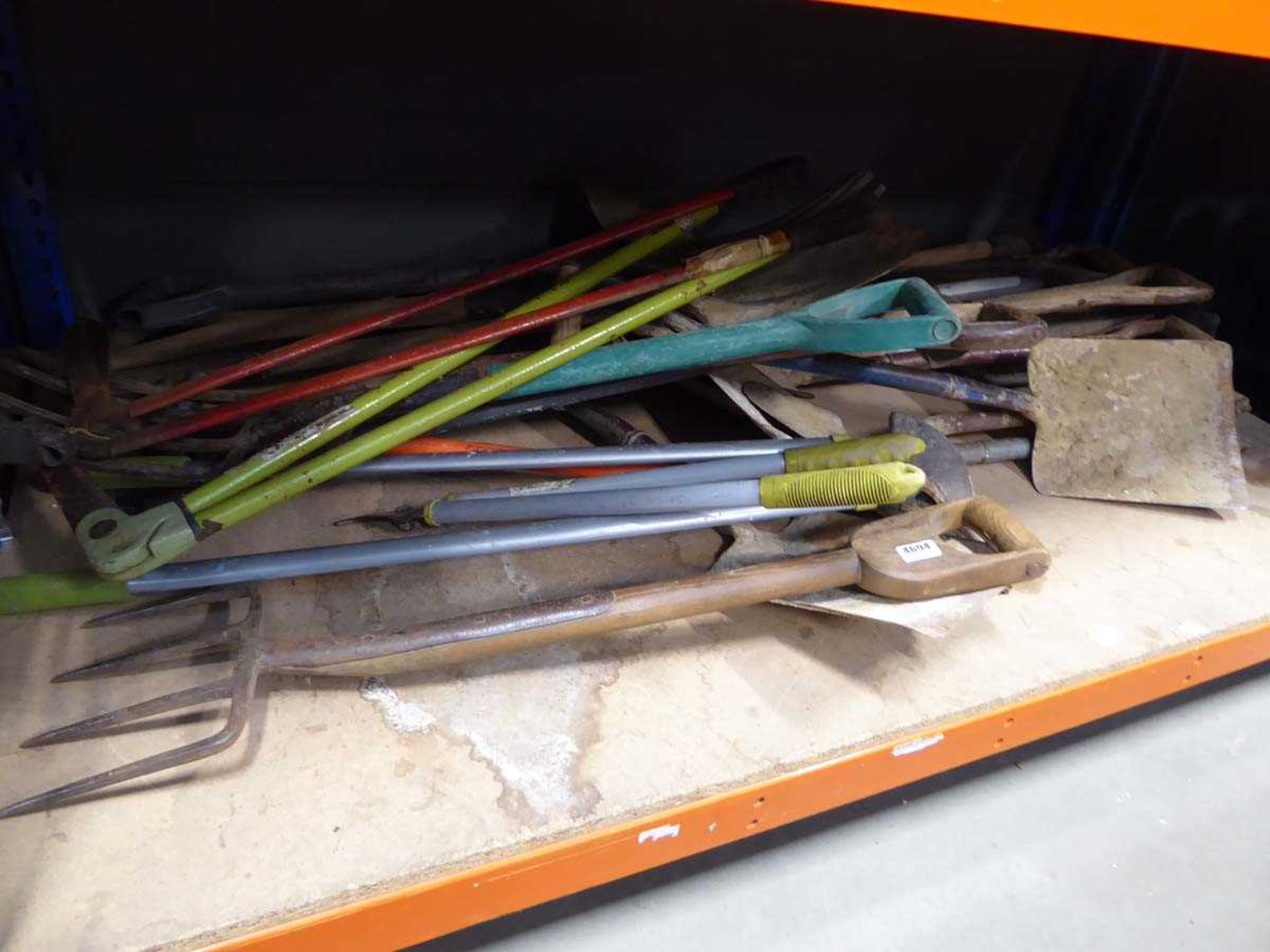 Underbay of assorted tools including forks, shears, edgers, spades etc