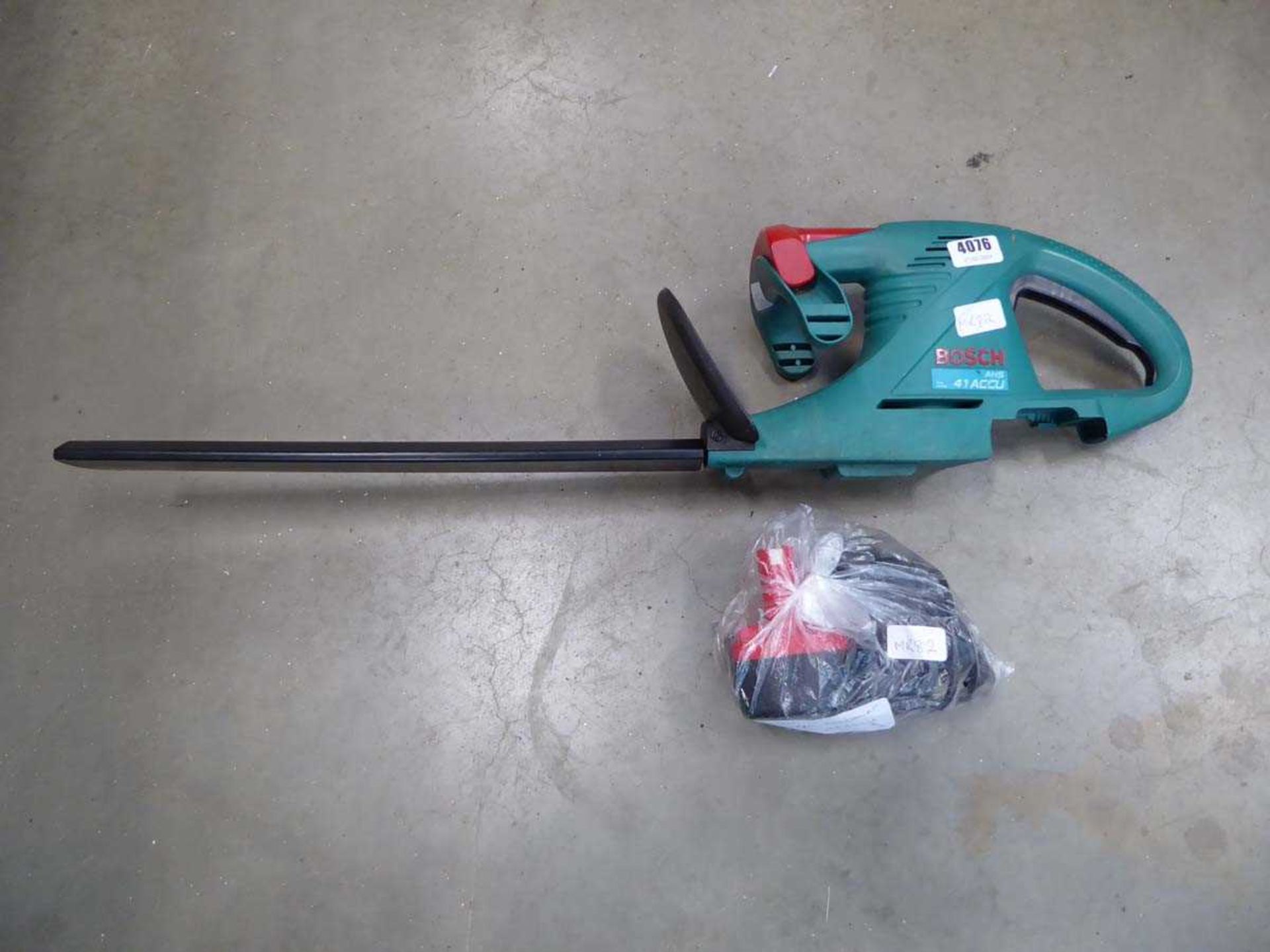 Bosch battery powered hedge cutter with battery and charger