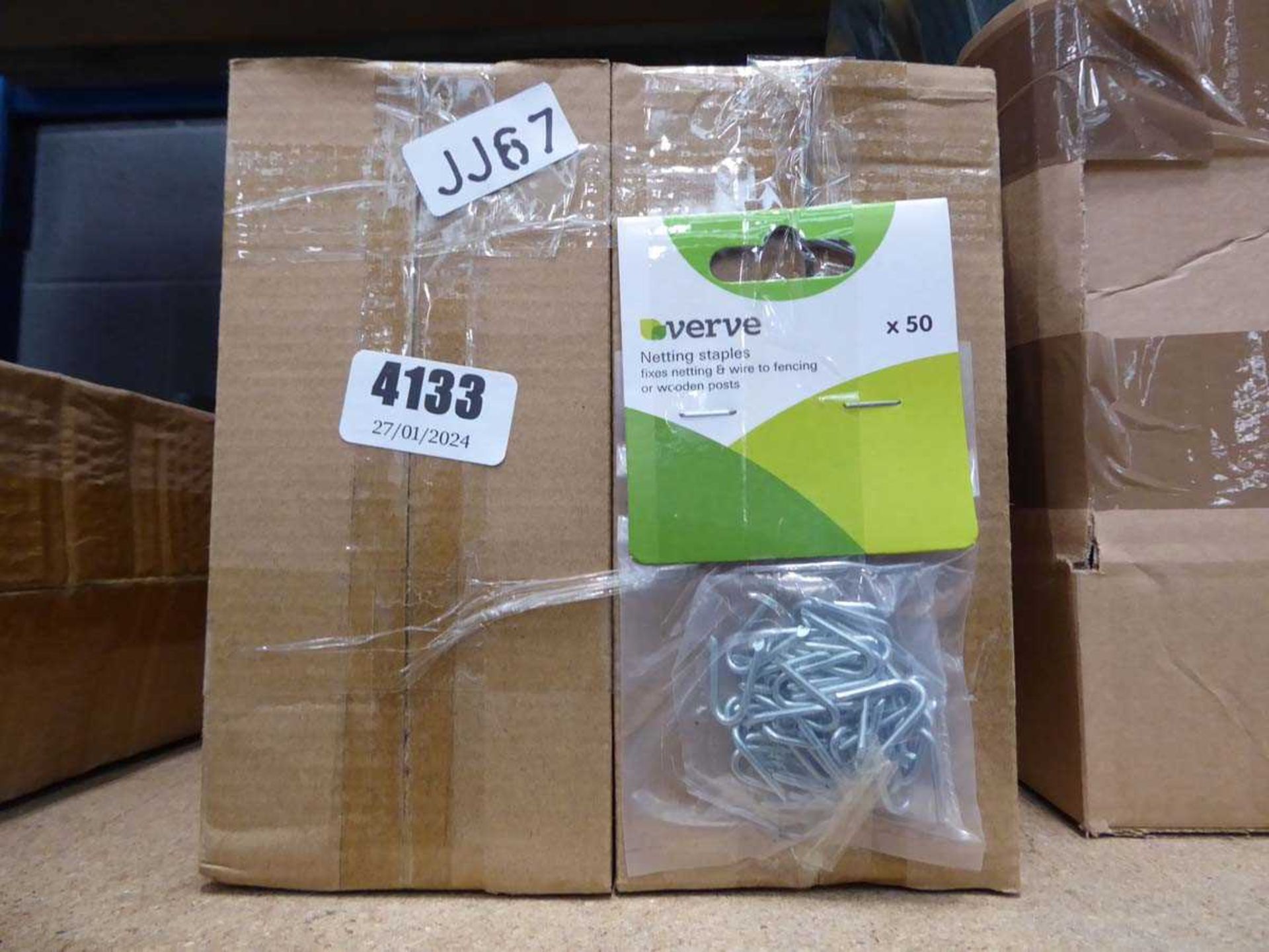Six small boxes of netting staples