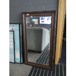 Rectangular bevelled mirror in dark wood frame