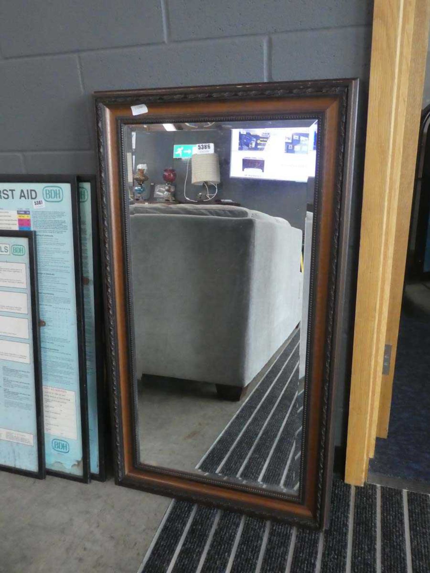 Rectangular bevelled mirror in dark wood frame