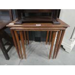 Nest of three teak tables