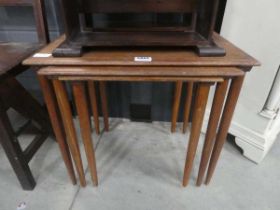 Nest of three teak tables