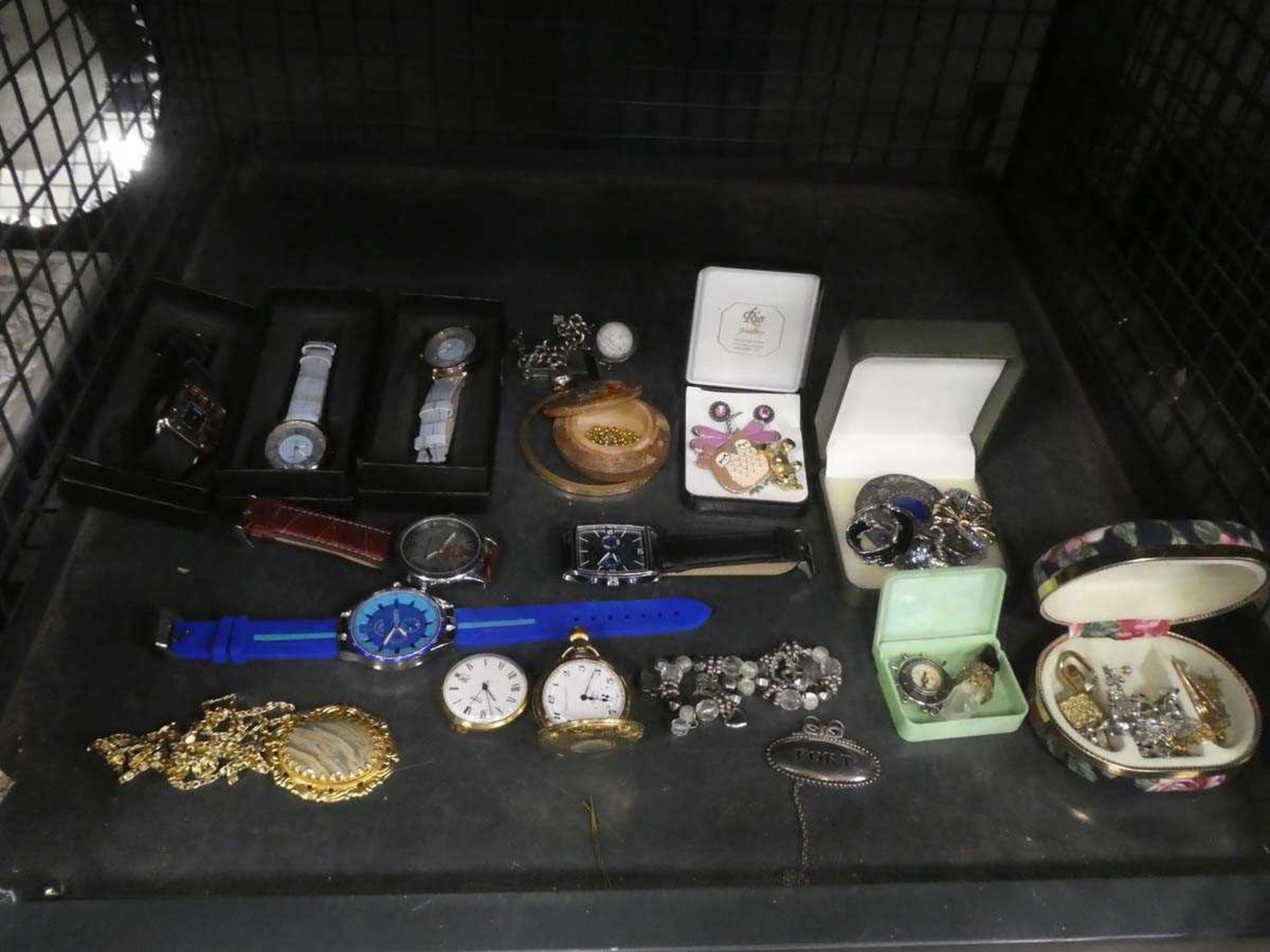 Cage containing costume jewellery and wrist watches
