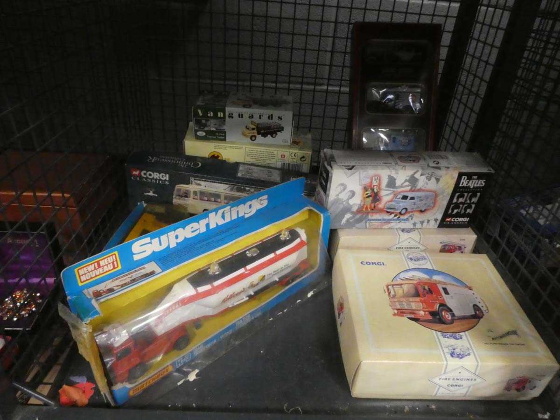 Cage containing Corgi and other boxed toys