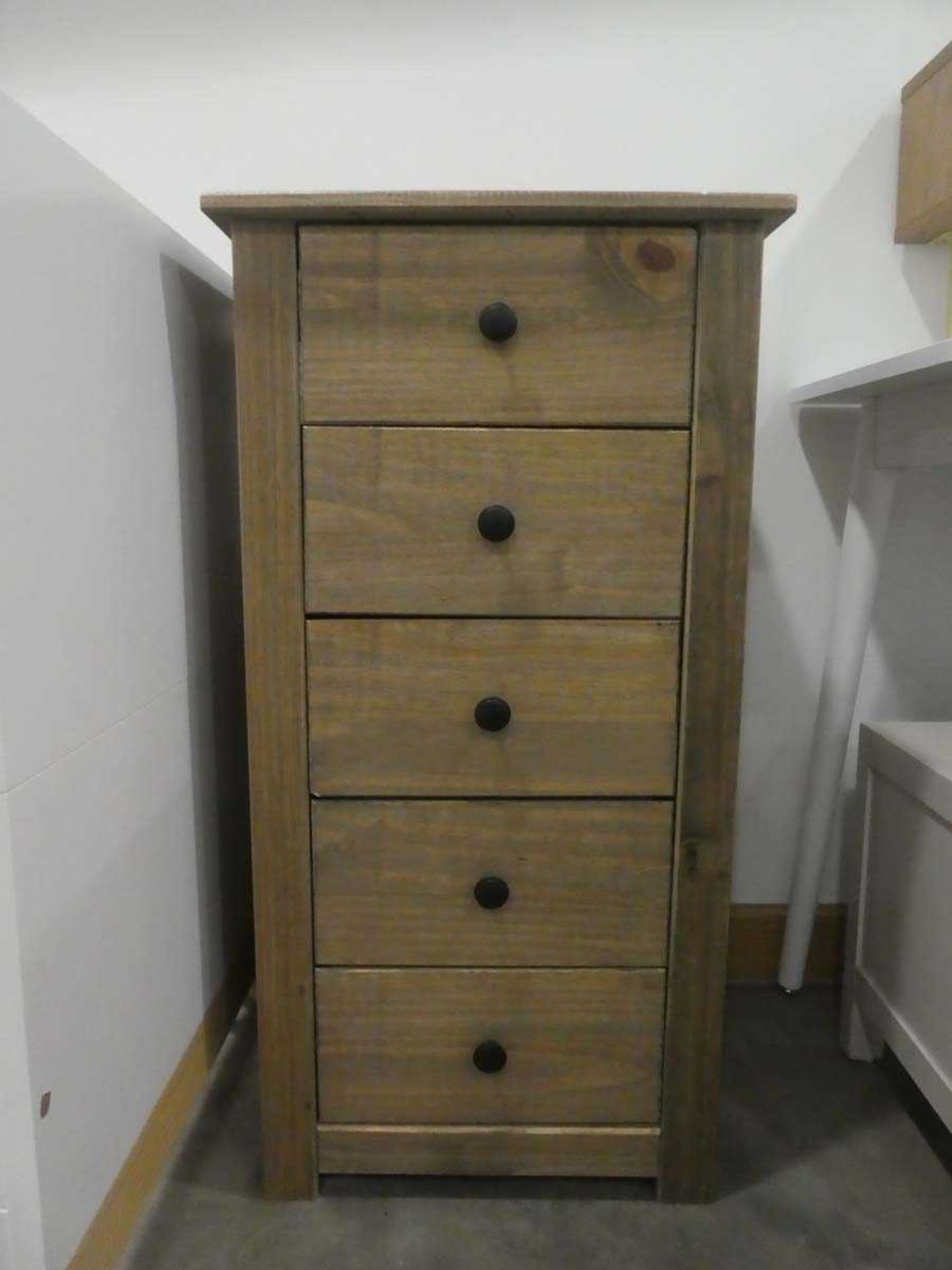 Pair of narrow pine finished chest of 5 drawers