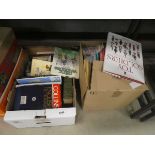 2 boxes containing war games, toy soldiers and other reference books