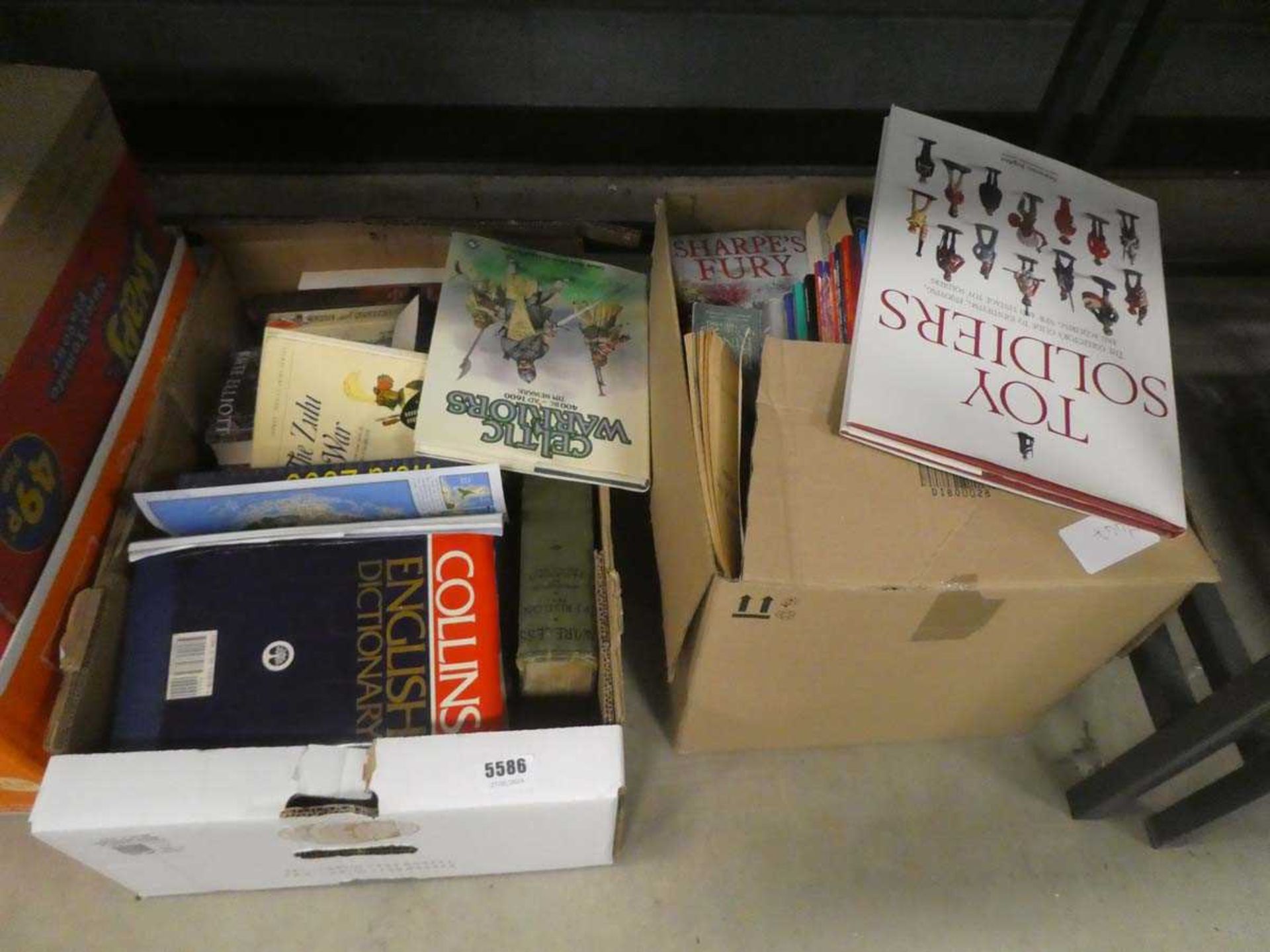 2 boxes containing war games, toy soldiers and other reference books