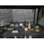 Cage containing a collection of paperweights