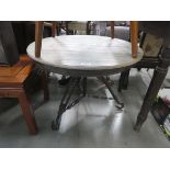 Faux pine circular table on metal industrial base