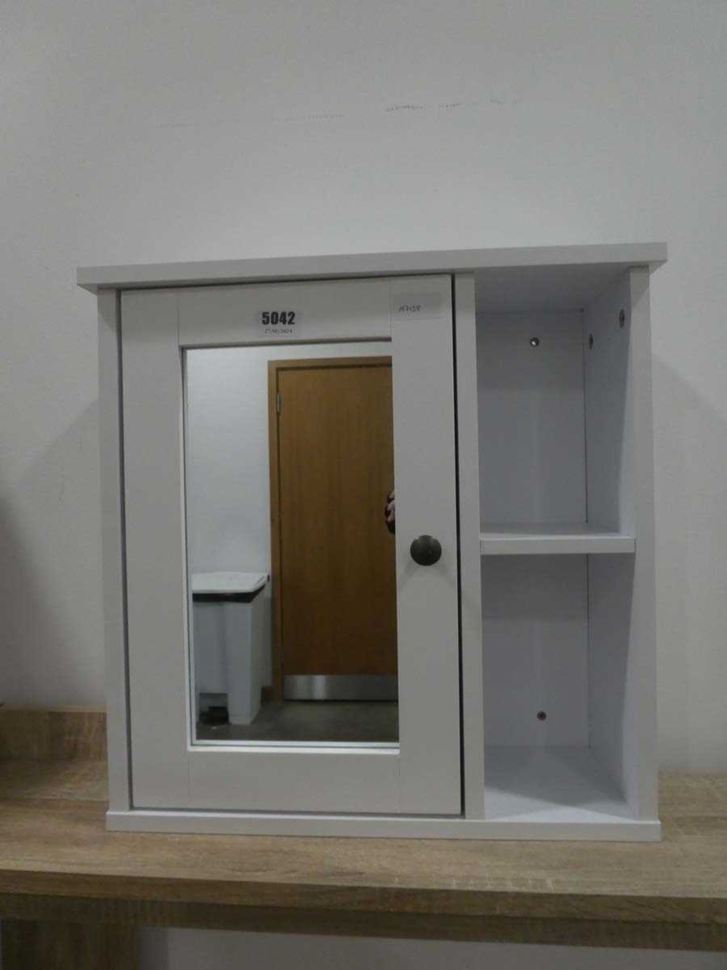 Mirrored single door bathroom cabinet with shelf to the side